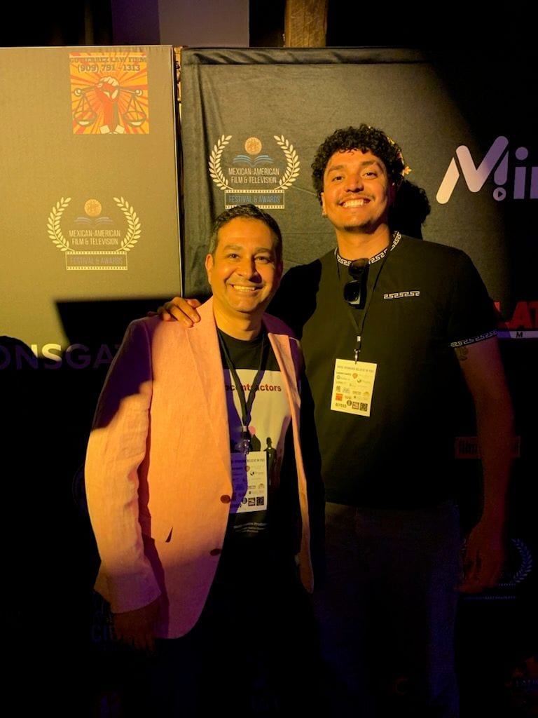 José Alfredo Alvarez with a collaborator at a film festival event.