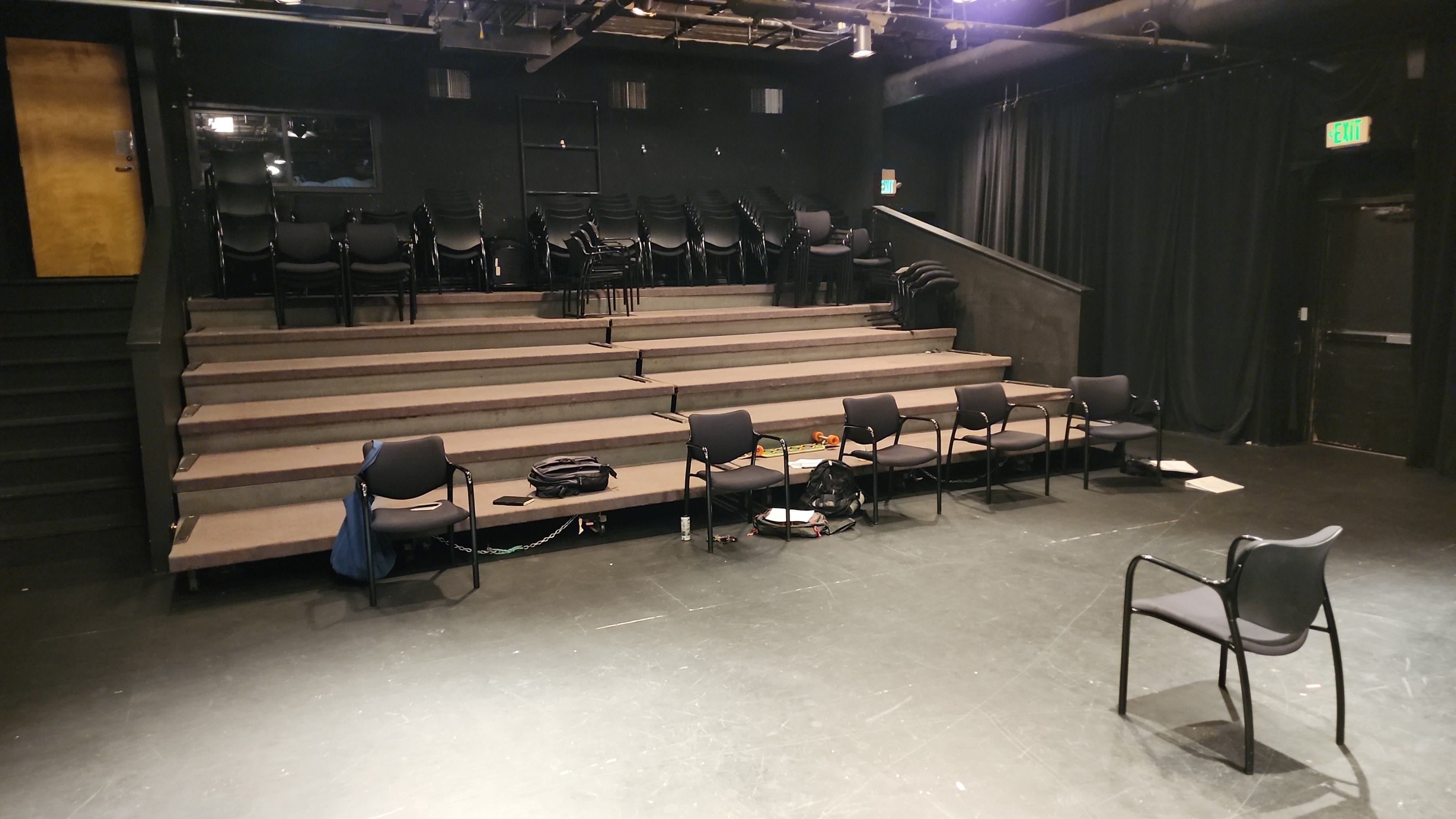 An intimate black-box theatre prepared for acting training.